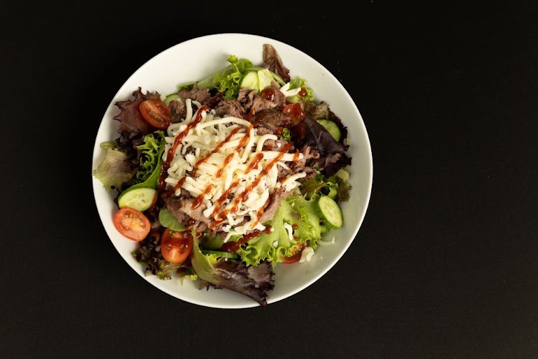 1/2 Pan Green Salad with Tomatoes and Cucumber at Bruce's Twisted BBQ