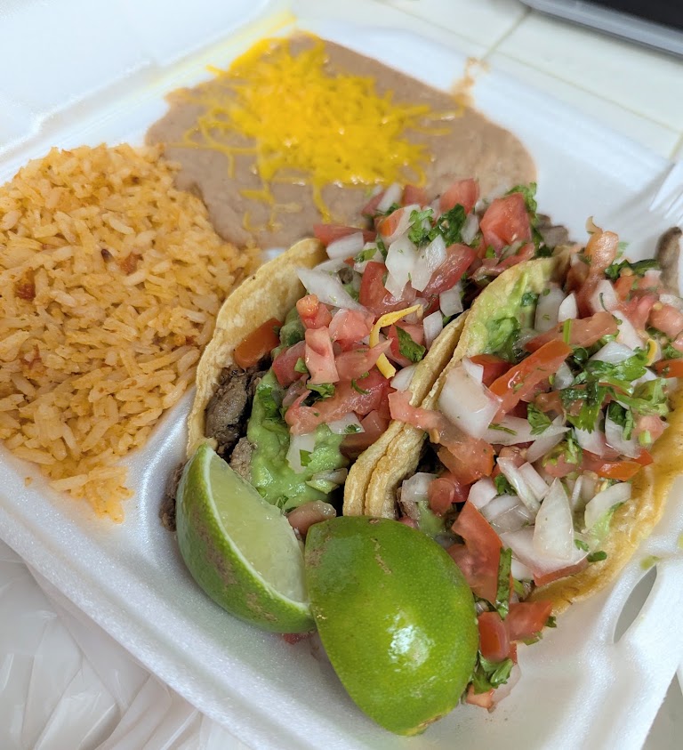 Two Carne Asada Tacos at Servandos Taco Shop