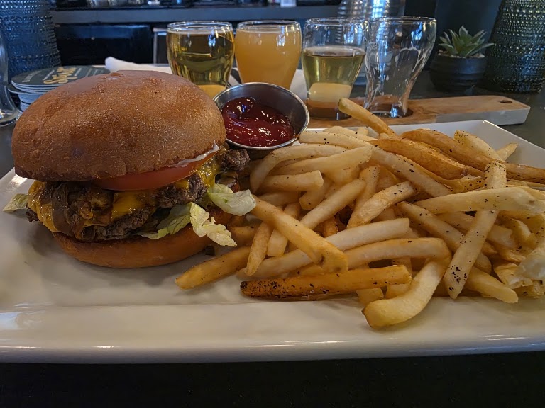 Cheeseburger Served with Fries at Blue Palms Brewhouse