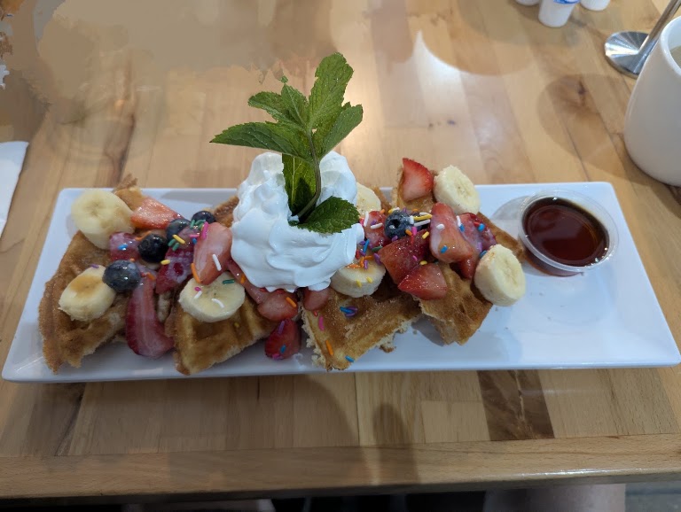 Churro Waffles with Fruit at Lola café