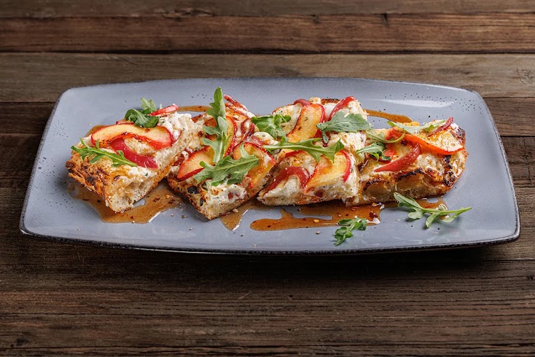 Peaches + Hot Honey Flatbread at Lazy Dog Restaurant & Bar