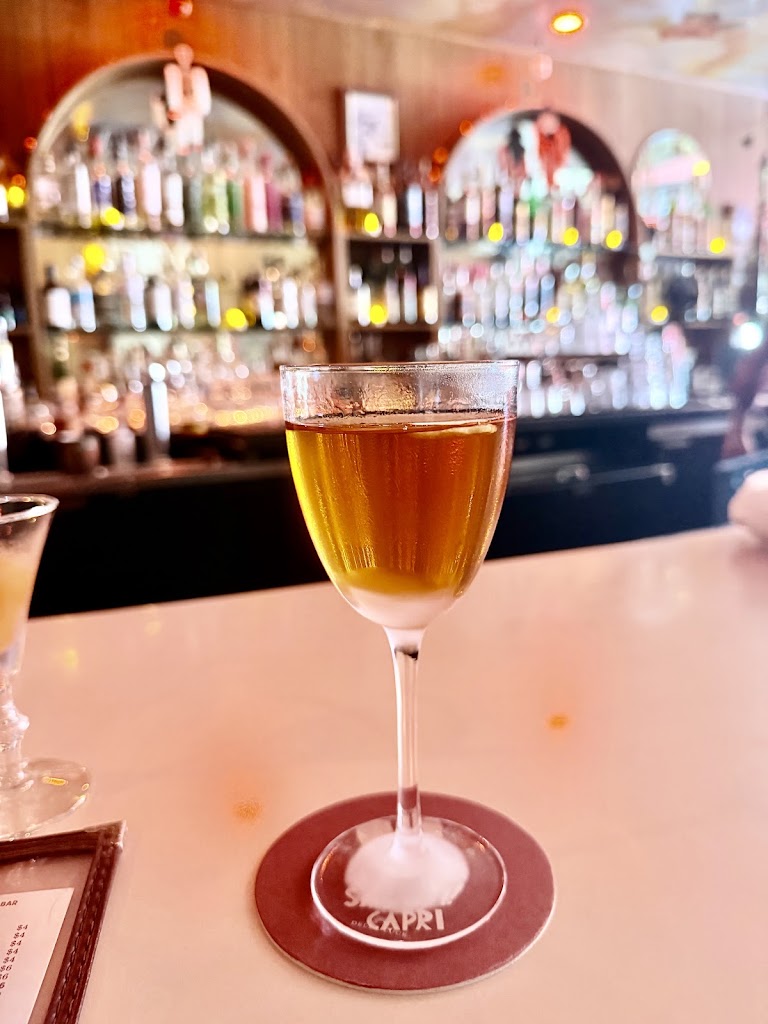 Iced Beverage (orange/amber Colored Drink) at Capri Club